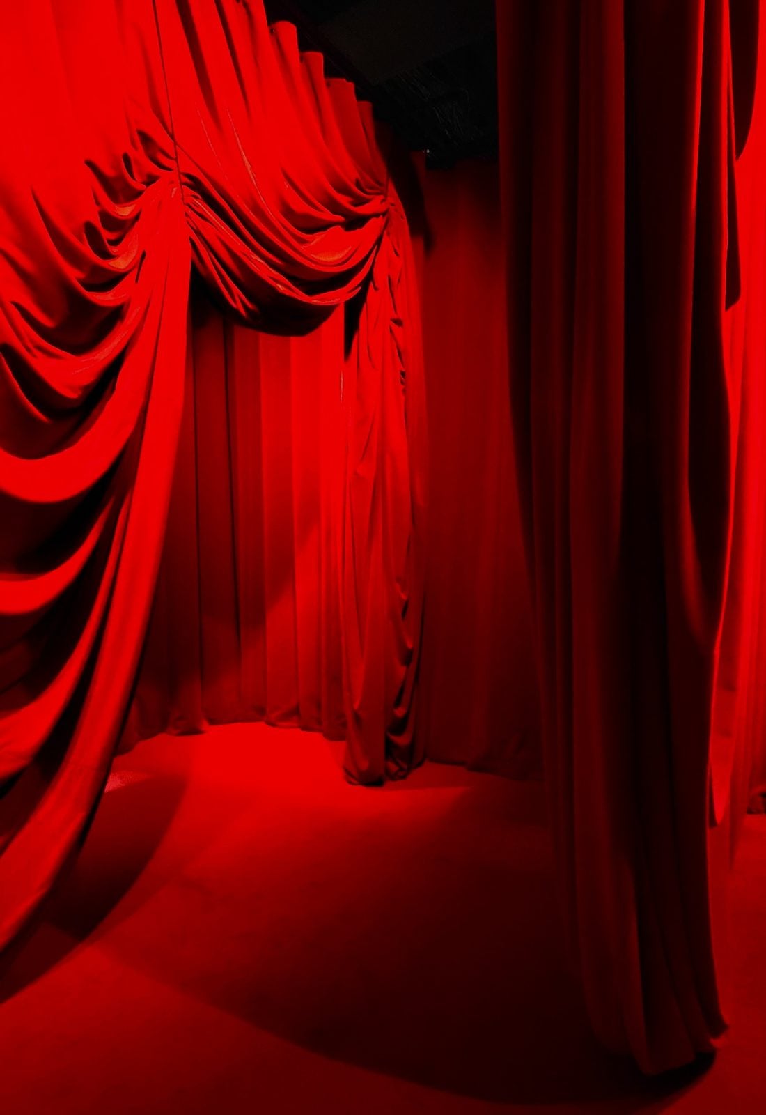 A dark red velvet-lined corridor....